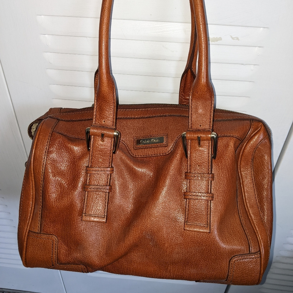 Calvin Klein large leather like barrel shape handbag.